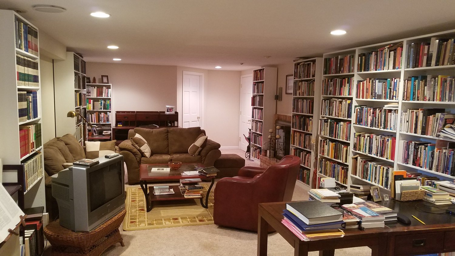 A basement library lined with bookshelves